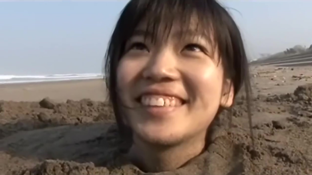 Girl Buried In Beach
